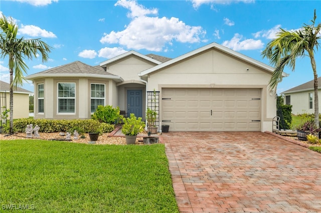 ranch-style house with a garage and a front yard