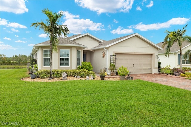 ranch-style house featuring a garage and a front lawn