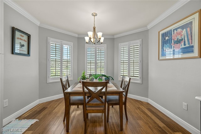 dining room with dark hardwood / wood-style flooring, a chandelier, and crown molding