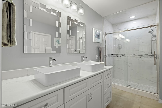 bathroom with vanity, walk in shower, and tile patterned floors