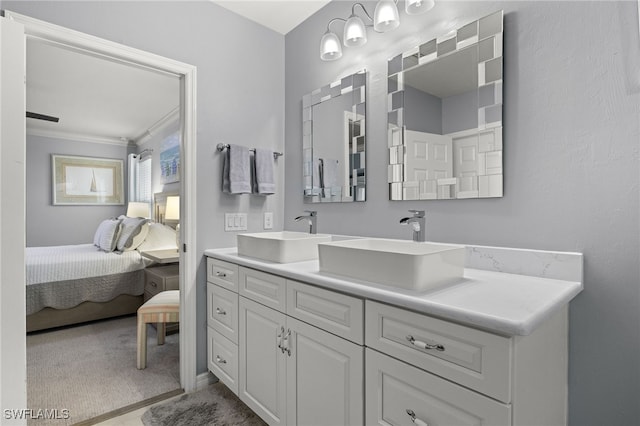 bathroom with vanity and ornamental molding