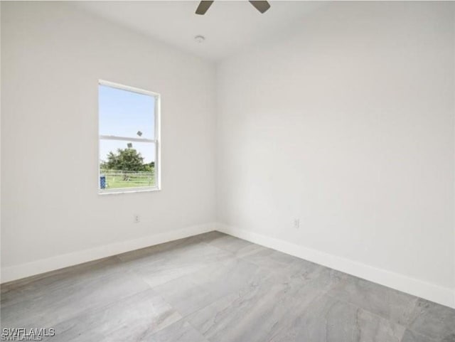 spare room with ceiling fan