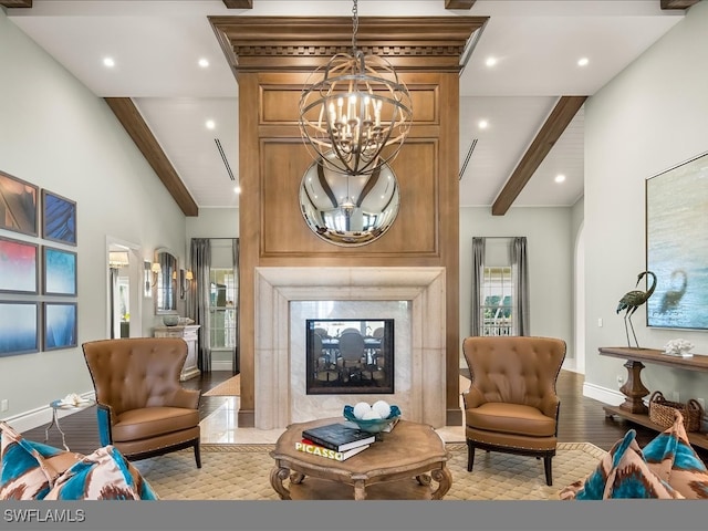 sitting room featuring beam ceiling, high vaulted ceiling, light hardwood / wood-style floors, and a notable chandelier