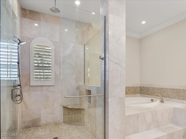 bathroom with crown molding, plus walk in shower, and tile walls