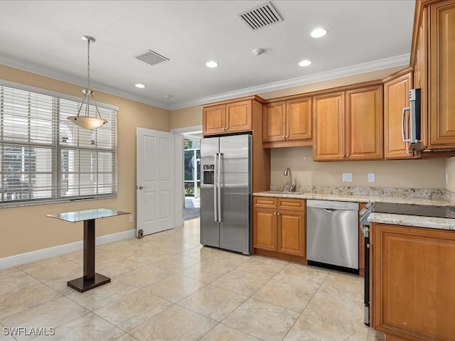 kitchen with light stone counters, stainless steel appliances, decorative light fixtures, and ornamental molding