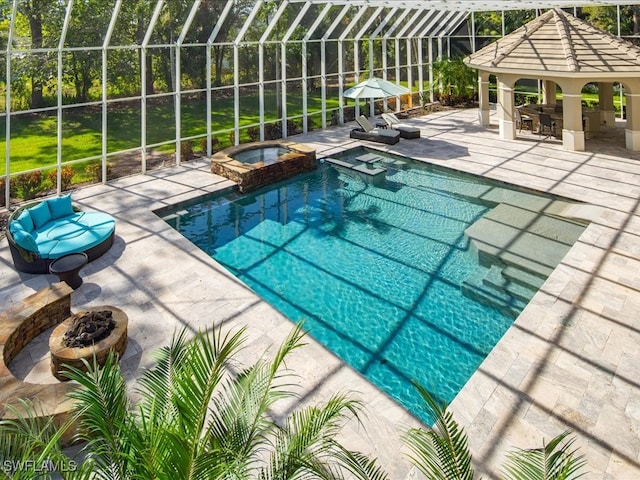 view of swimming pool with a lanai, exterior bar, a gazebo, a patio area, and an in ground hot tub