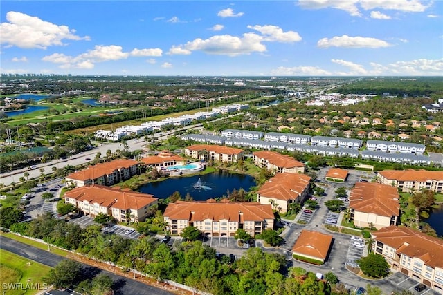 aerial view featuring a residential view and a water view