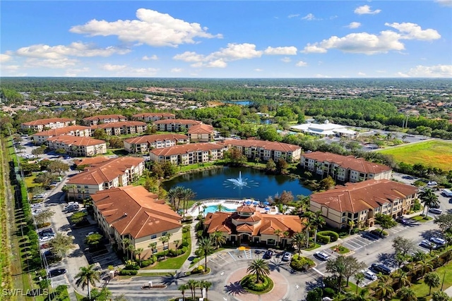 aerial view with a residential view and a water view