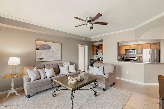 living area featuring baseboards, a ceiling fan, light tile patterned floors, and ornamental molding