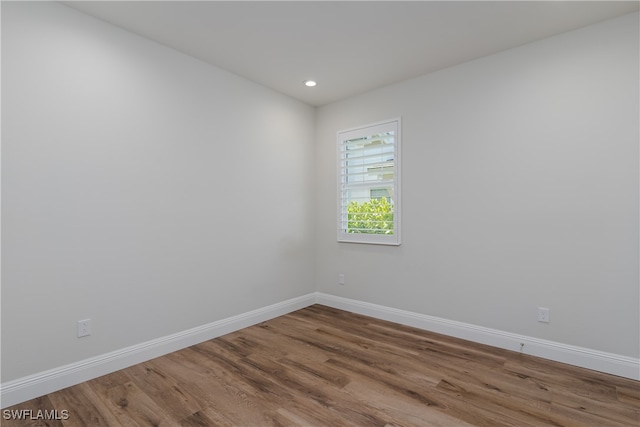 unfurnished room featuring wood-type flooring