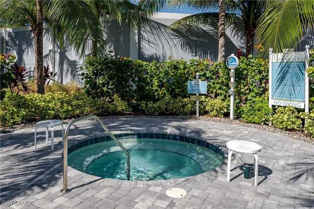 view of pool featuring a hot tub