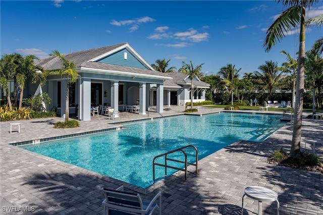 view of swimming pool with a patio area