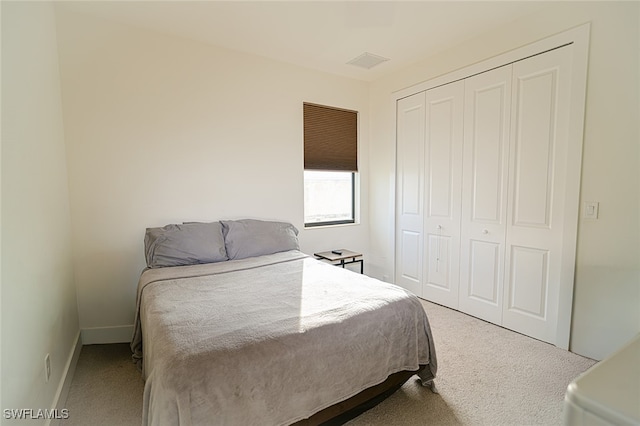 bedroom with a closet and carpet