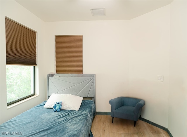 bedroom with light hardwood / wood-style flooring