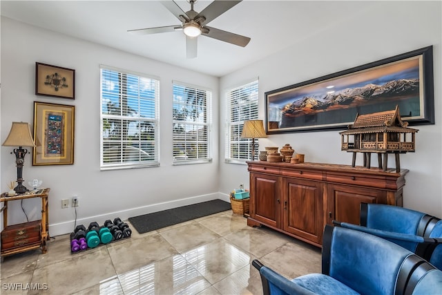 living area with ceiling fan