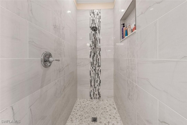 bathroom with a tile shower