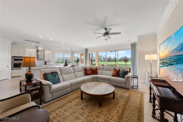 living room featuring recessed lighting, baseboards, crown molding, and a ceiling fan