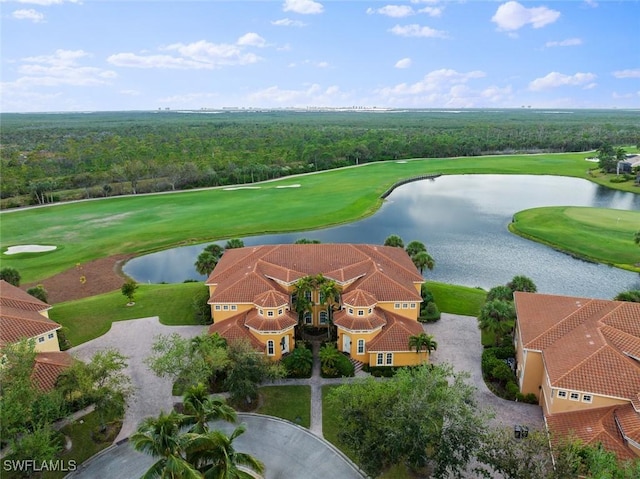 aerial view with golf course view and a water view