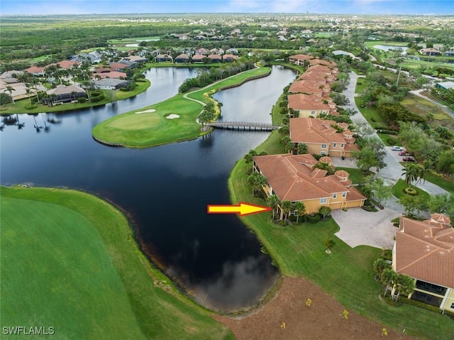 drone / aerial view featuring a residential view and a water view