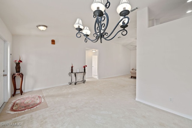 dining room featuring light carpet and vaulted ceiling