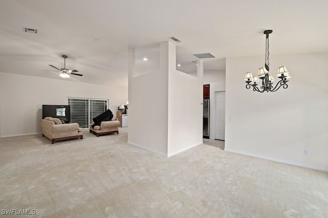 unfurnished room with light carpet, ceiling fan with notable chandelier, and lofted ceiling