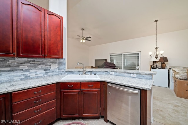 kitchen with light colored carpet, hanging light fixtures, sink, stainless steel dishwasher, and light stone countertops