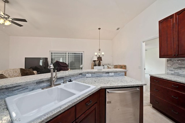 kitchen with lofted ceiling, sink, stainless steel dishwasher, ceiling fan with notable chandelier, and decorative backsplash