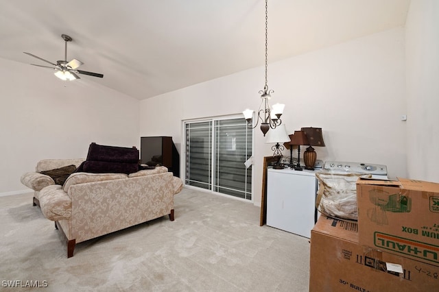 carpeted living room with ceiling fan with notable chandelier, lofted ceiling, and washing machine and dryer