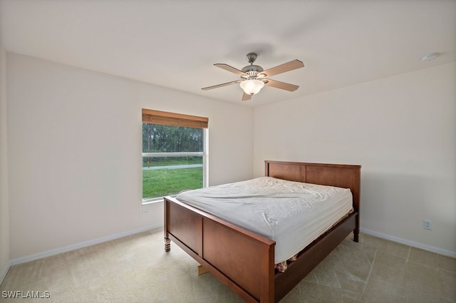 bedroom with light colored carpet and ceiling fan