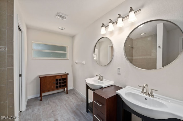 bathroom featuring vanity and hardwood / wood-style floors