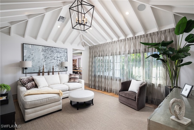 sunroom with vaulted ceiling with beams and a notable chandelier