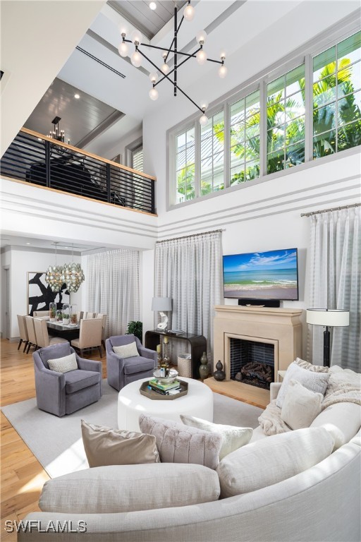 living room with hardwood / wood-style floors and a high ceiling