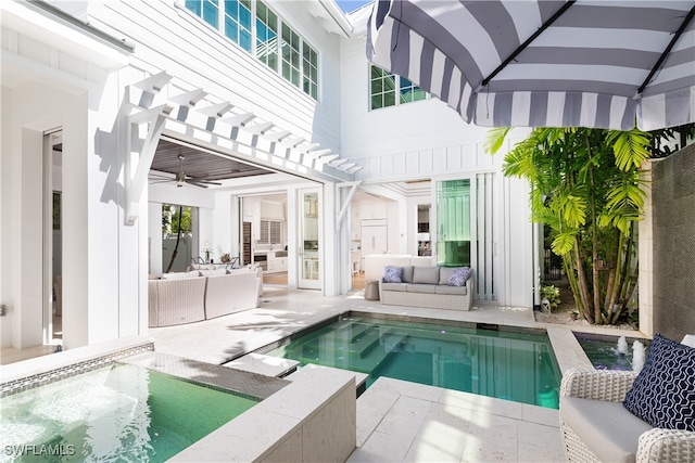 back of house featuring a pergola, ceiling fan, a patio, and an outdoor hangout area