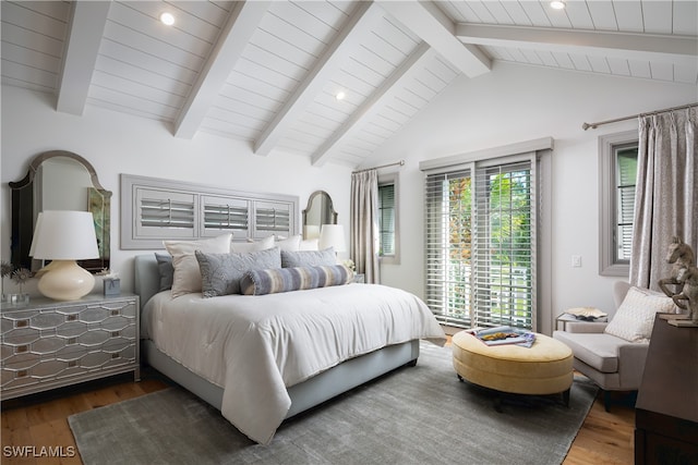 bedroom with hardwood / wood-style floors and lofted ceiling with beams