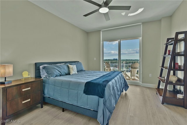 bedroom featuring ceiling fan, light wood-type flooring, and access to outside