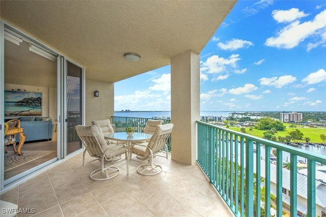 balcony featuring a water view