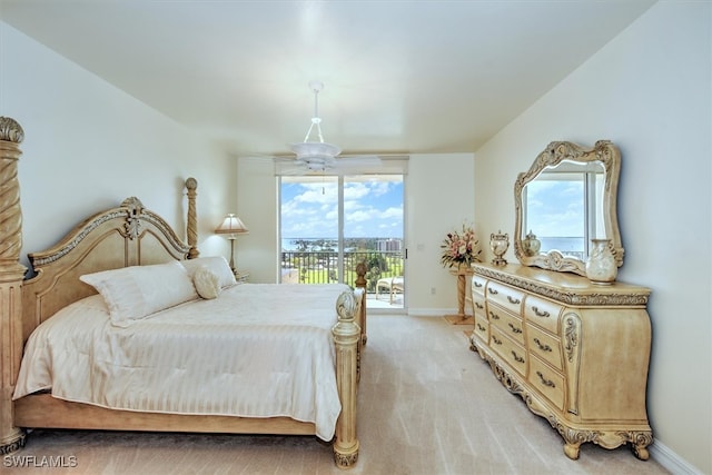 bedroom with light colored carpet and access to outside