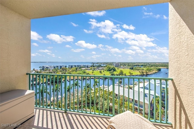 balcony featuring a water view