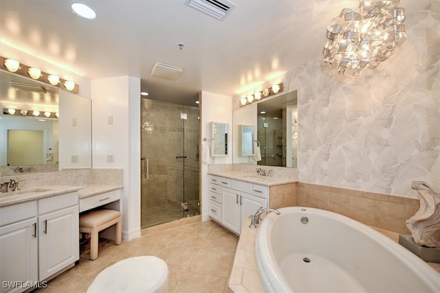 bathroom with tile patterned flooring, shower with separate bathtub, and vanity