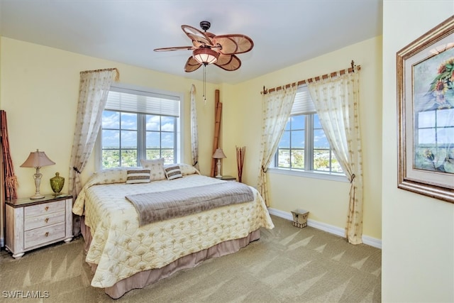 bedroom with light colored carpet and ceiling fan