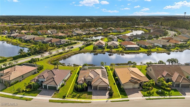 drone / aerial view with a water view