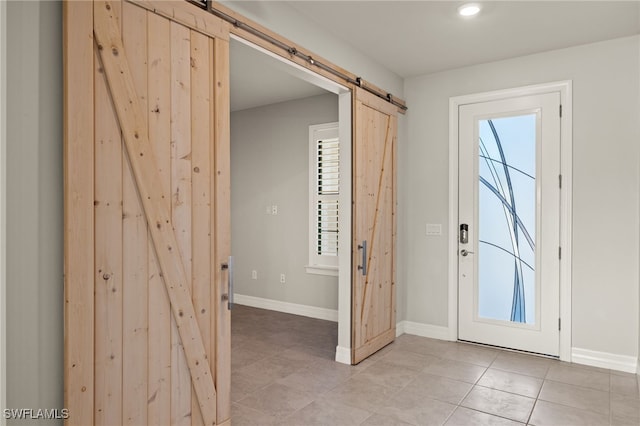 entrance foyer featuring a barn door