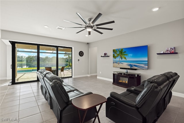 tiled living room with ceiling fan