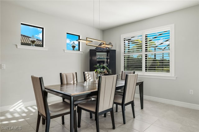 dining space with light tile patterned flooring