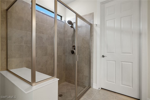 bathroom featuring tile patterned floors and walk in shower