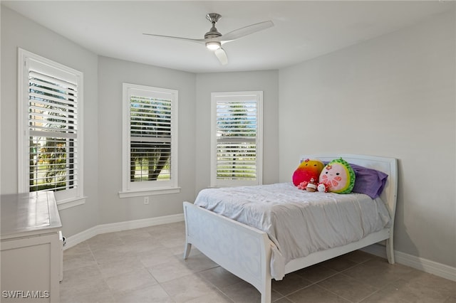 tiled bedroom with ceiling fan