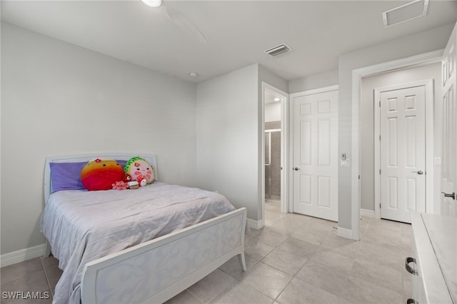 bedroom featuring ceiling fan and light tile patterned flooring