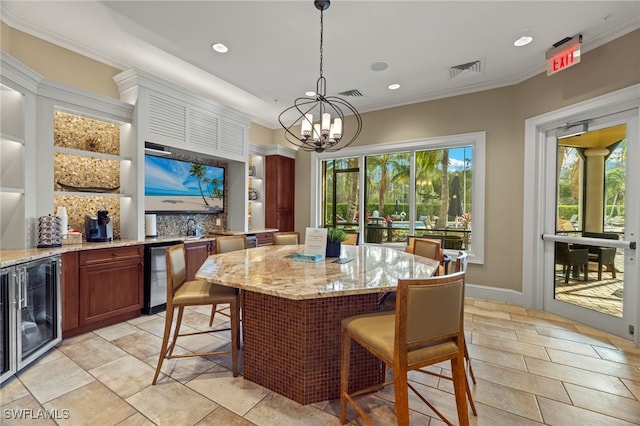 tiled dining space with wine cooler, ornamental molding, and a chandelier