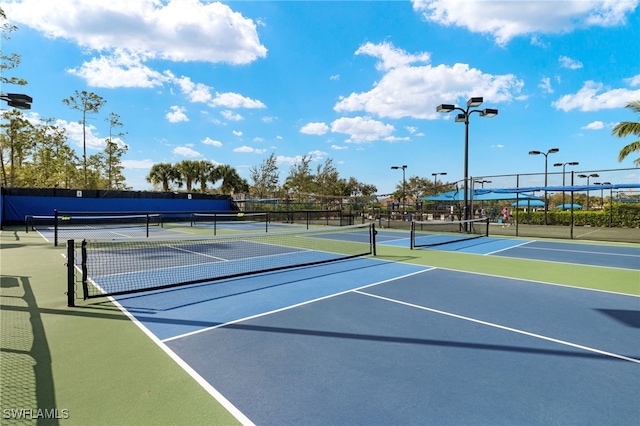 view of sport court with basketball hoop