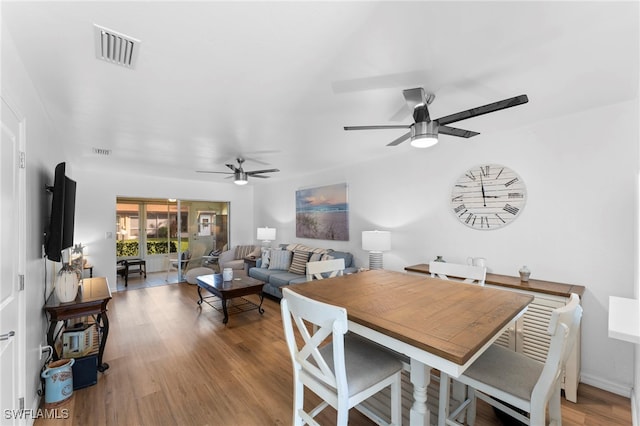 dining area featuring hardwood / wood-style flooring and ceiling fan